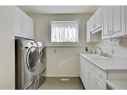 2820 Morley Trail Nw, Calgary, AB - Indoor Photo Showing Laundry Room