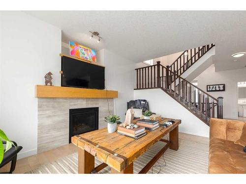 9 Cougar Ridge Cove Sw, Calgary, AB - Indoor With Fireplace