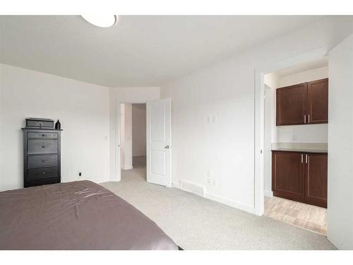 9 Cougar Ridge Cove Sw, Calgary, AB - Indoor Photo Showing Bedroom