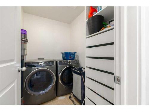 9 Cougar Ridge Cove Sw, Calgary, AB - Indoor Photo Showing Laundry Room