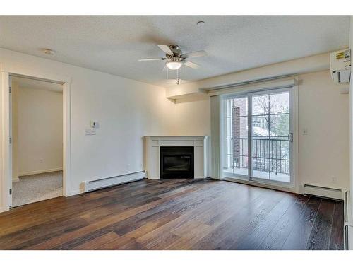 5211-279 Copperpond Common Se, Calgary, AB - Indoor Photo Showing Living Room With Fireplace
