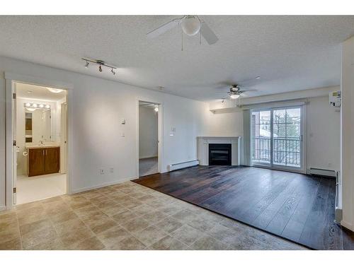 5211-279 Copperpond Common Se, Calgary, AB - Indoor Photo Showing Living Room With Fireplace