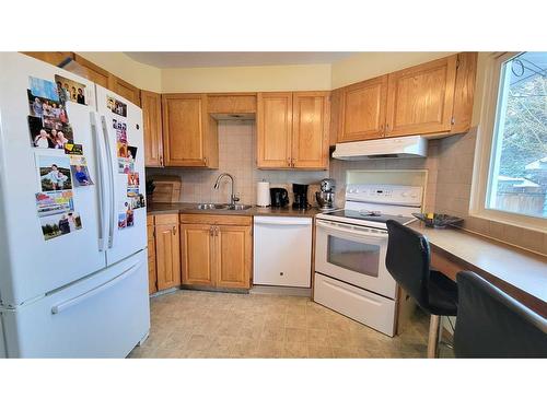 374 Westwood Drive Sw, Calgary, AB - Indoor Photo Showing Kitchen With Double Sink