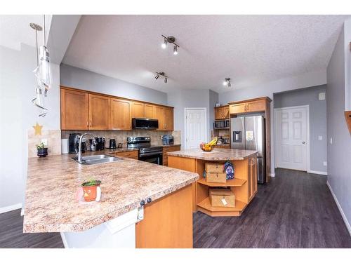 9 Copperpond Link Se, Calgary, AB - Indoor Photo Showing Kitchen With Double Sink