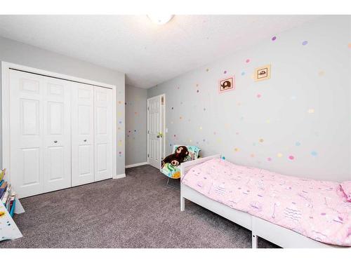 9 Copperpond Link Se, Calgary, AB - Indoor Photo Showing Bedroom