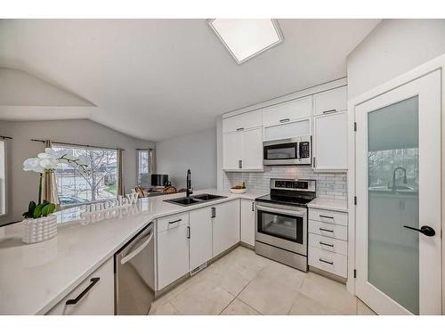 23 Country Hills Link Nw, Calgary, AB - Indoor Photo Showing Kitchen With Double Sink