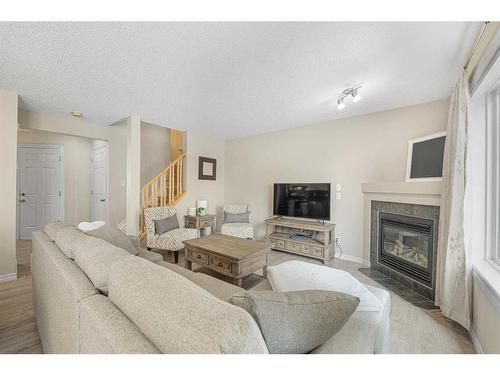 276-371 Marina Drive, Chestermere, AB - Indoor Photo Showing Living Room With Fireplace