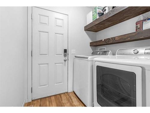 338 Sunset Common, Cochrane, AB - Indoor Photo Showing Laundry Room