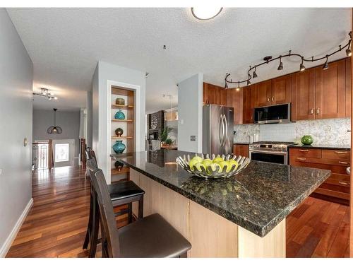 323 Woodside Circle Sw, Calgary, AB - Indoor Photo Showing Kitchen With Stainless Steel Kitchen With Upgraded Kitchen