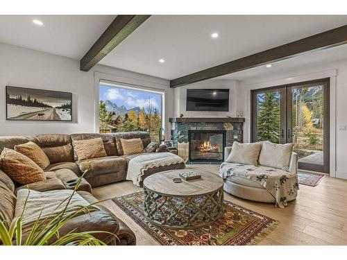 628 Silvertip Road, Canmore, AB - Indoor Photo Showing Living Room With Fireplace