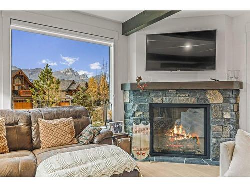 628 Silvertip Road, Canmore, AB - Indoor Photo Showing Living Room With Fireplace