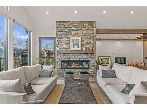 628 Silvertip Road, Canmore, AB - Indoor Photo Showing Living Room With Fireplace