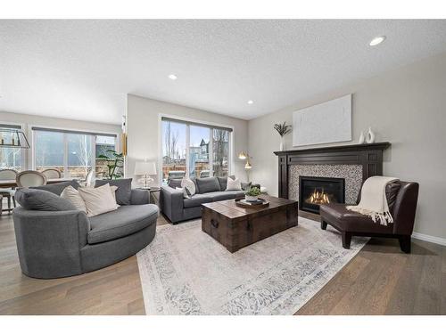 147 Auburn Shores Way Se, Calgary, AB - Indoor Photo Showing Living Room With Fireplace