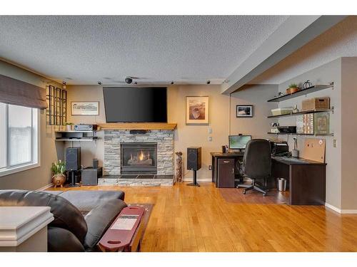 338 Millrise Drive Sw, Calgary, AB - Indoor Photo Showing Living Room With Fireplace