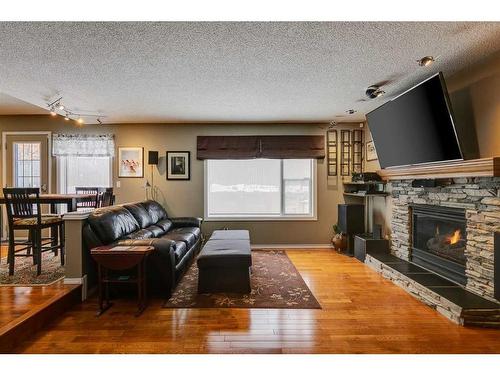 338 Millrise Drive Sw, Calgary, AB - Indoor Photo Showing Living Room With Fireplace