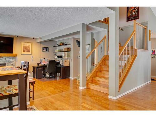 338 Millrise Drive Sw, Calgary, AB - Indoor Photo Showing Other Room With Fireplace