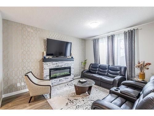 536 Redstone Drive Ne, Calgary, AB - Indoor Photo Showing Living Room With Fireplace