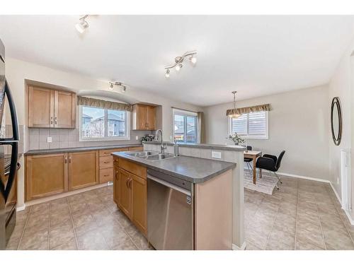 75 Bridlecrest Road Sw, Calgary, AB - Indoor Photo Showing Kitchen With Double Sink