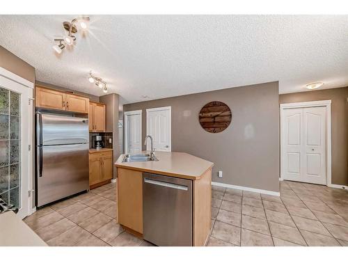 127 Cranberry Way Se, Calgary, AB - Indoor Photo Showing Kitchen With Double Sink