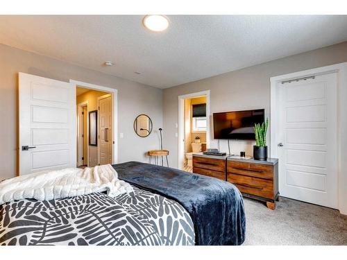 137 Creekside Boulevard Sw, Calgary, AB - Indoor Photo Showing Bedroom