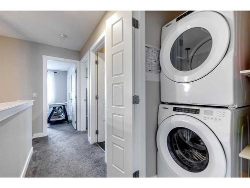 137 Creekside Boulevard Sw, Calgary, AB - Indoor Photo Showing Laundry Room