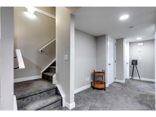 137 Creekside Boulevard Sw, Calgary, AB - Indoor Photo Showing Other Room