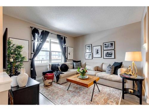 137 Creekside Boulevard Sw, Calgary, AB - Indoor Photo Showing Living Room