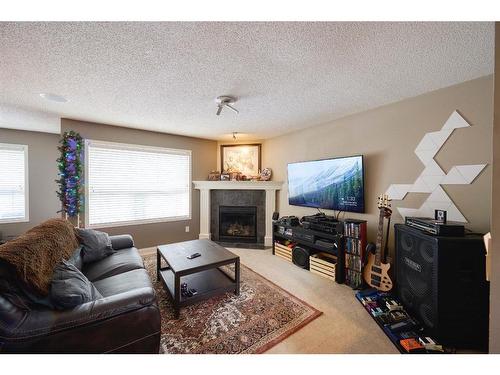 913 Cranston Drive Se, Calgary, AB - Indoor Photo Showing Living Room With Fireplace