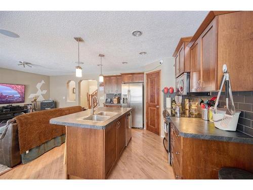 913 Cranston Drive Se, Calgary, AB - Indoor Photo Showing Kitchen With Double Sink