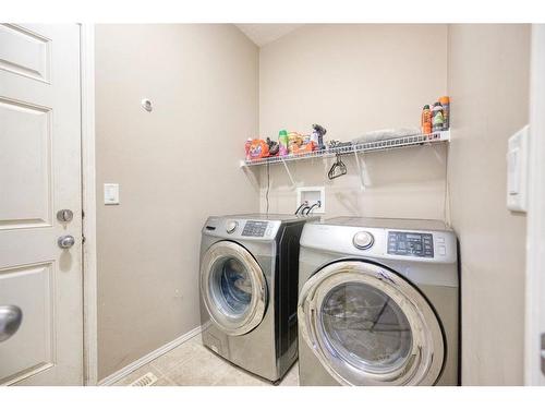 913 Cranston Drive Se, Calgary, AB - Indoor Photo Showing Laundry Room