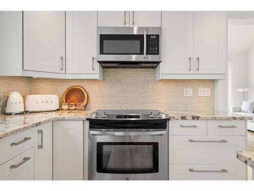 116 Stradwick Rise Sw, Calgary, AB - Indoor Photo Showing Kitchen With Upgraded Kitchen