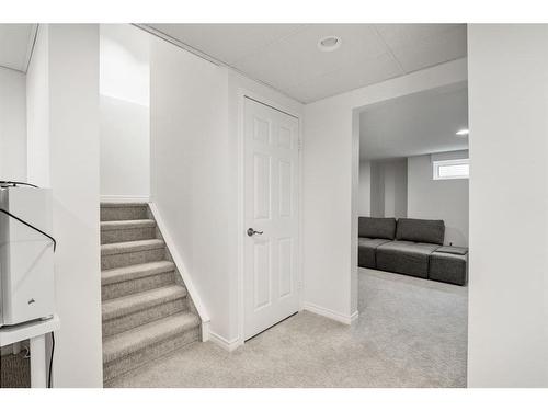 116 Stradwick Rise Sw, Calgary, AB - Indoor Photo Showing Other Room