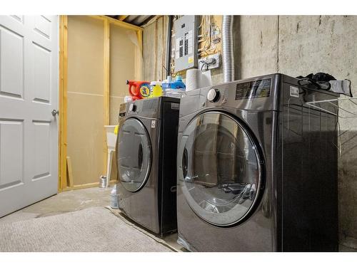 116 Stradwick Rise Sw, Calgary, AB - Indoor Photo Showing Laundry Room