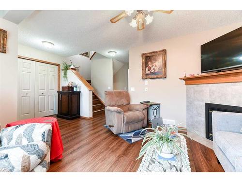 35 Saddlemead Green Ne, Calgary, AB - Indoor Photo Showing Living Room With Fireplace