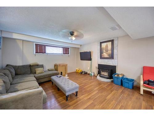 36 Taylor Way Se, Airdrie, AB - Indoor With Fireplace