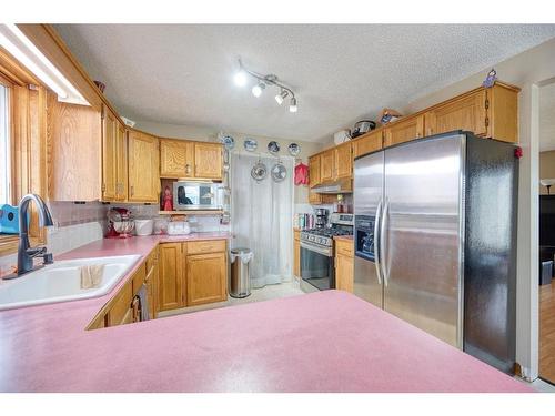 36 Taylor Way Se, Airdrie, AB - Indoor Photo Showing Kitchen With Stainless Steel Kitchen