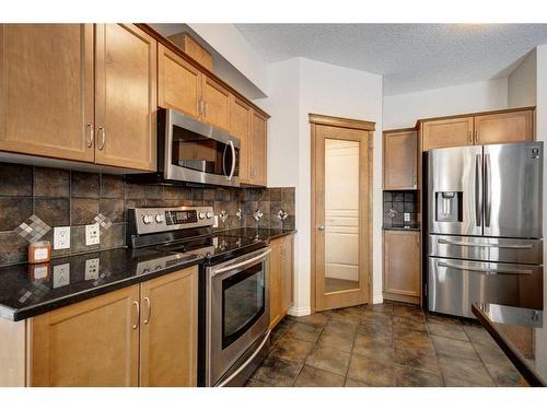 15 Cranleigh Mews Se, Calgary, AB - Indoor Photo Showing Kitchen With Stainless Steel Kitchen
