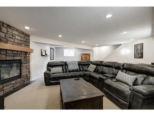 15 Cranleigh Mews Se, Calgary, AB - Indoor Photo Showing Other Room With Fireplace