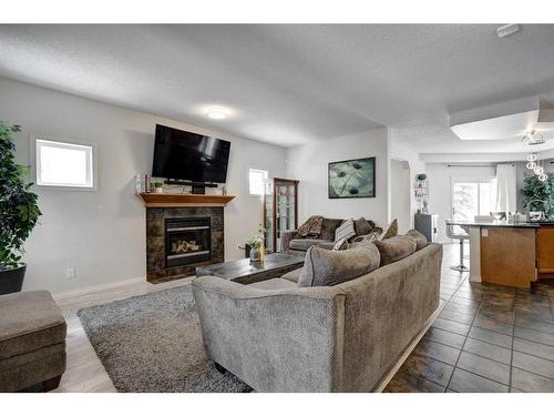 15 Cranleigh Mews Se, Calgary, AB - Indoor Photo Showing Living Room With Fireplace