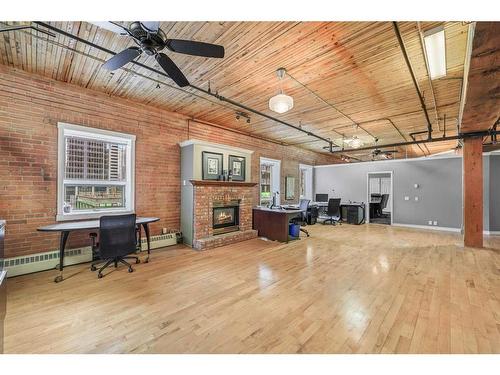 401-535 10 Avenue Sw, Calgary, AB - Indoor Photo Showing Other Room With Fireplace