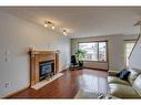 11460 Coventry Boulevard Ne, Calgary, AB  - Indoor Photo Showing Living Room With Fireplace 