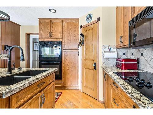 38 Crystalridge Way, Okotoks, AB - Indoor Photo Showing Kitchen With Double Sink