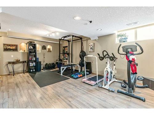 38 Crystalridge Way, Okotoks, AB - Indoor Photo Showing Gym Room