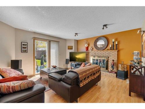 138 Riverglen Close Se, Calgary, AB - Indoor Photo Showing Living Room With Fireplace