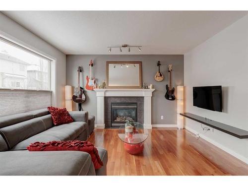 46 Royal Birch Landing Nw, Calgary, AB - Indoor Photo Showing Living Room With Fireplace