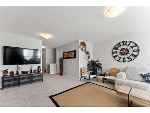 65 Howse Common Ne, Calgary, AB - Indoor Photo Showing Living Room