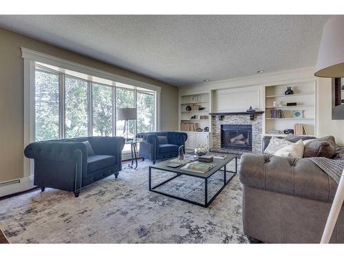 285223 Rr11, Crossfield, AB - Indoor Photo Showing Living Room With Fireplace