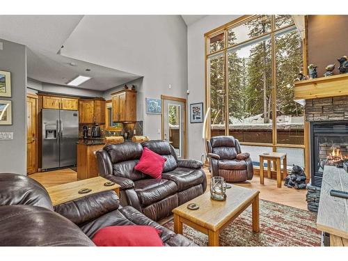 622-107 Armstrong Place, Canmore, AB - Indoor Photo Showing Living Room With Fireplace