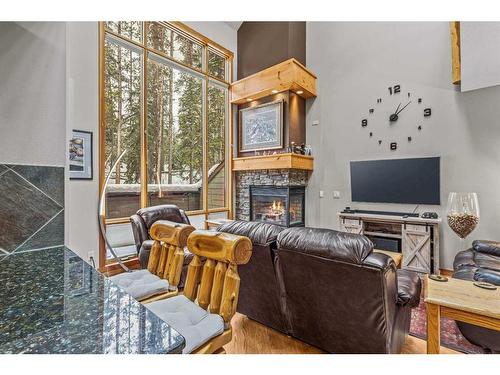 622-107 Armstrong Place, Canmore, AB - Indoor With Fireplace