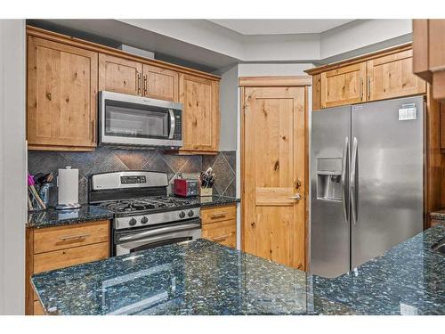 622-107 Armstrong Place, Canmore, AB - Indoor Photo Showing Kitchen With Stainless Steel Kitchen